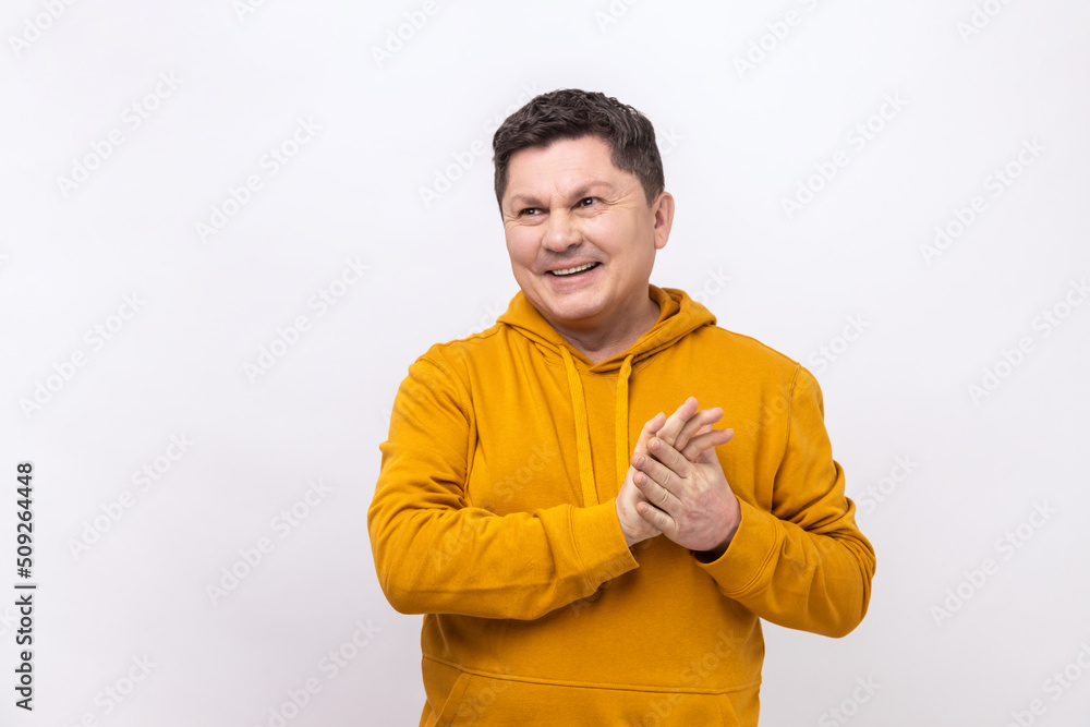 Portrait of attractive dreamy hopeful man of middle age dreaming thinking, meditating imaging bright future, wearing urban style hoodie. Indoor studio shot isolated on white background. Portrait of attractive dreamy hopeful man of middle age dreaming thinking, meditating imaging bright future, wearing urban style hoodie. Indoor studio shot isolated on white background.