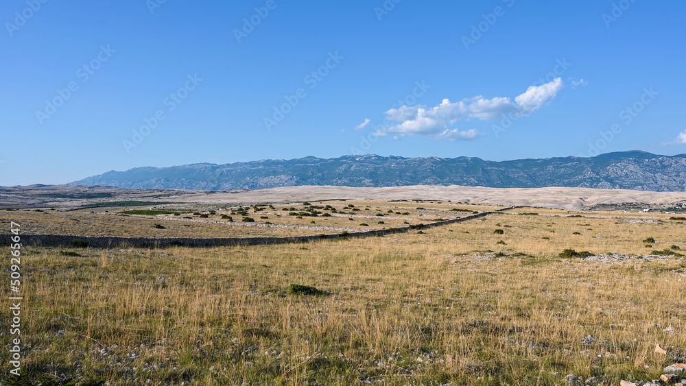 The island of Pag and the Velebit mountain in the background. Croatia, EU. 