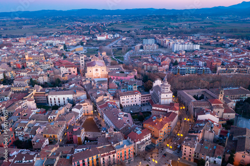 Aerial view of historic district of Vic town with ancient cathedral on winter twilight, Catalonia, Spain.. photo