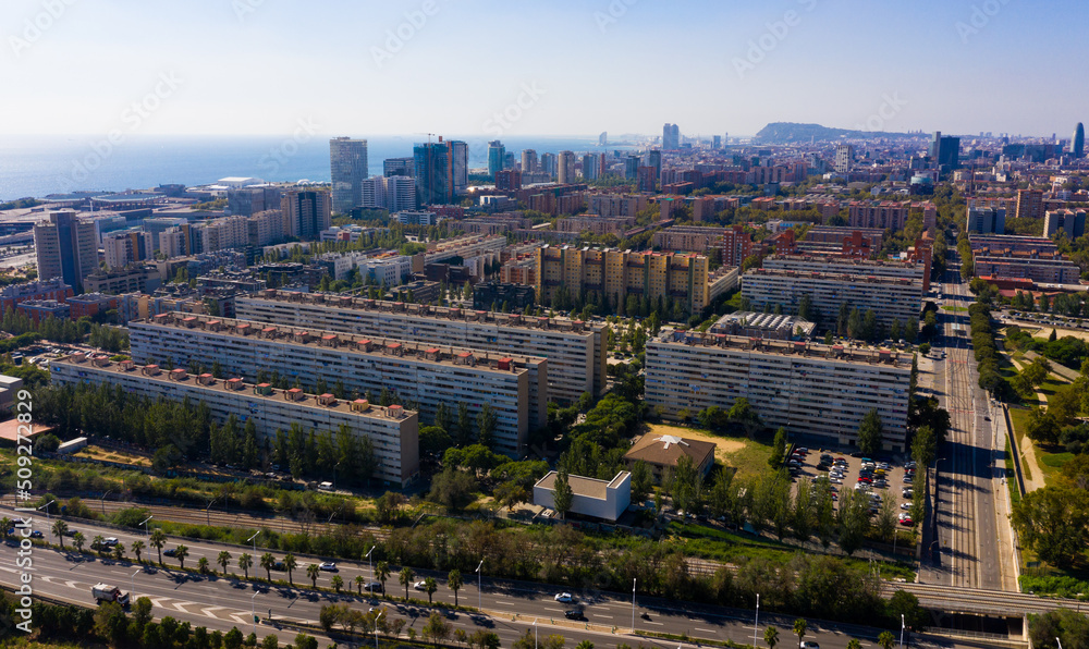 Aerial panoramic view of Barcelona modern neighborhood of Diagonal Mar i el Front Maritim del Poblenou on Mediterranean coast, Spain