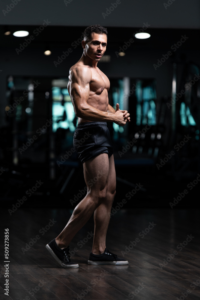 Bodybuilder With Problem Flexing Muscles Stock Photo