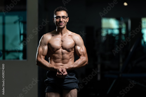 Bodybuilder With Gynecomastia Problem Flexing Muscles