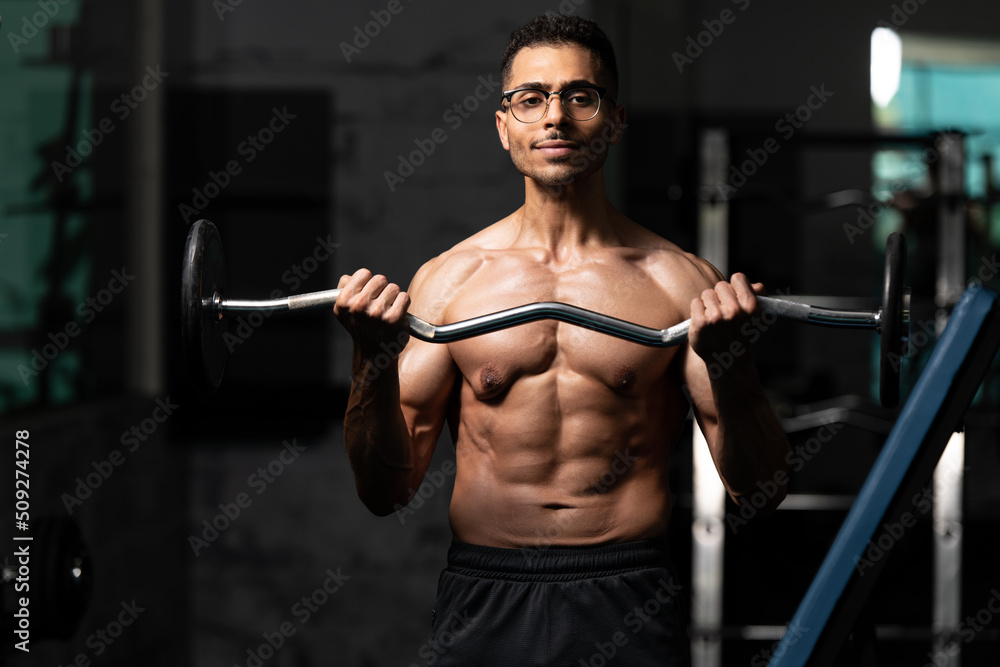 Man With Gynecomastia Problem Working Out Biceps