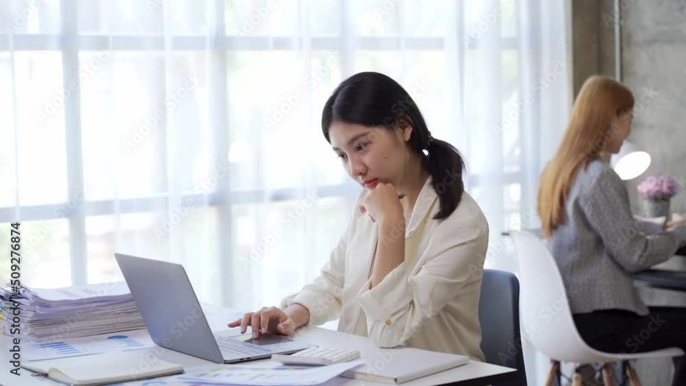 Business asian woman work on computer laptop in office. Business asian woman work on computer laptop in office.