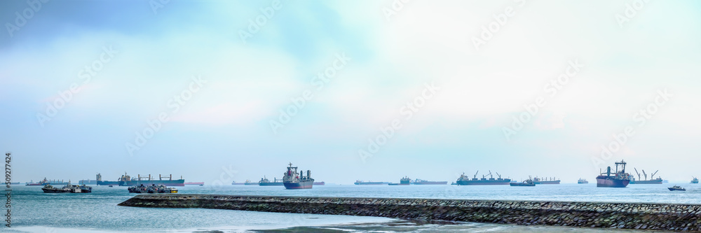 sea at Singaport strait with many container ship and cargo vessels