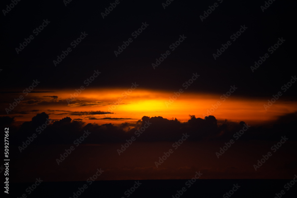dark sky in sunset time with orange sun