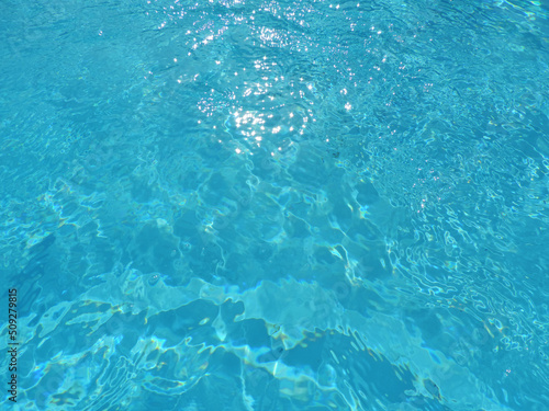 Blue pool water waves texture background © Alex Jauk