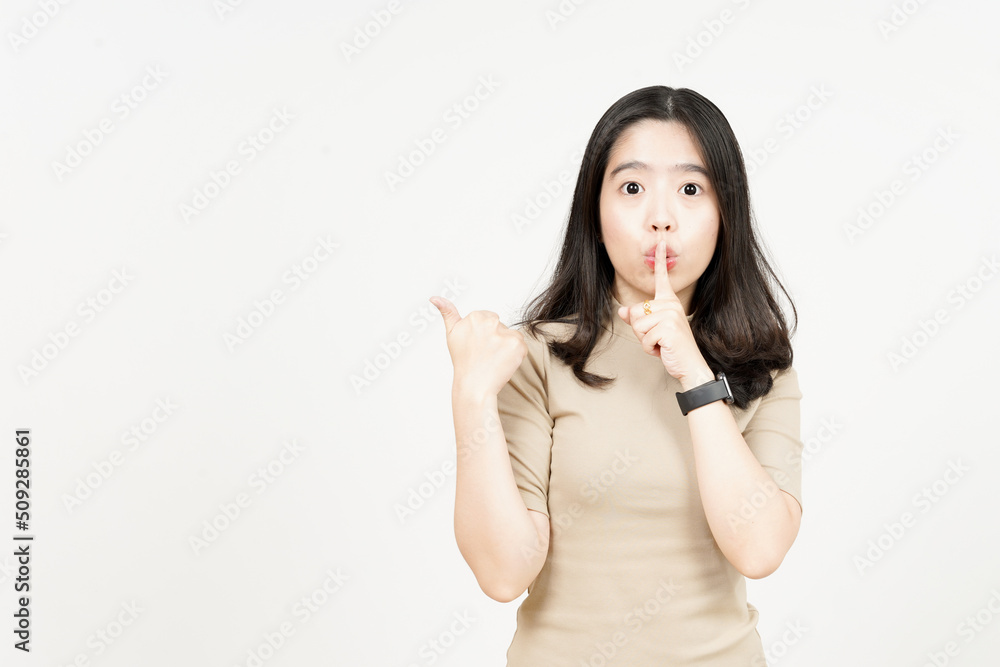 Promo pointing side product and finger on lips Of Beautiful Asian Woman Isolated On White Background Promo pointing side product and finger on lips Of Beautiful Asian Woman Isolated On White Background