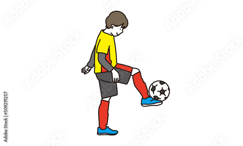サッカーをするアジア人の子供