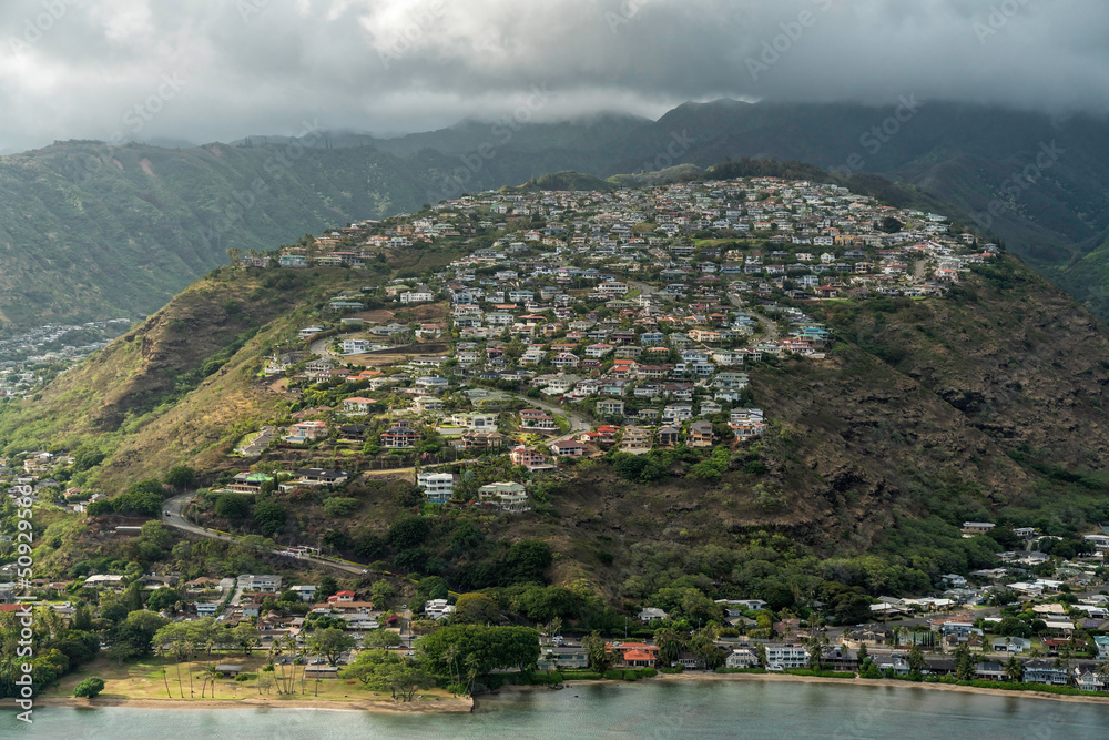 Residential houses on the steep hillside with twisty road leading to the top, Oahu Island, Hawaii