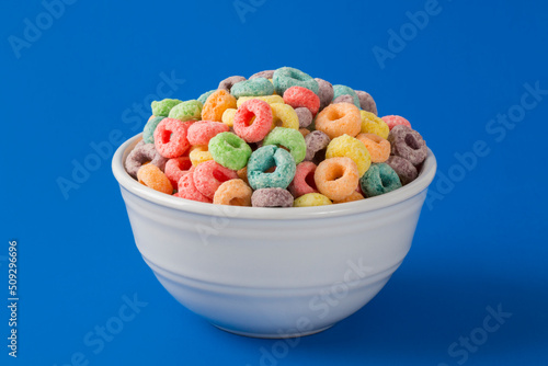 Colorful Fruity Cereal on a Blue Background