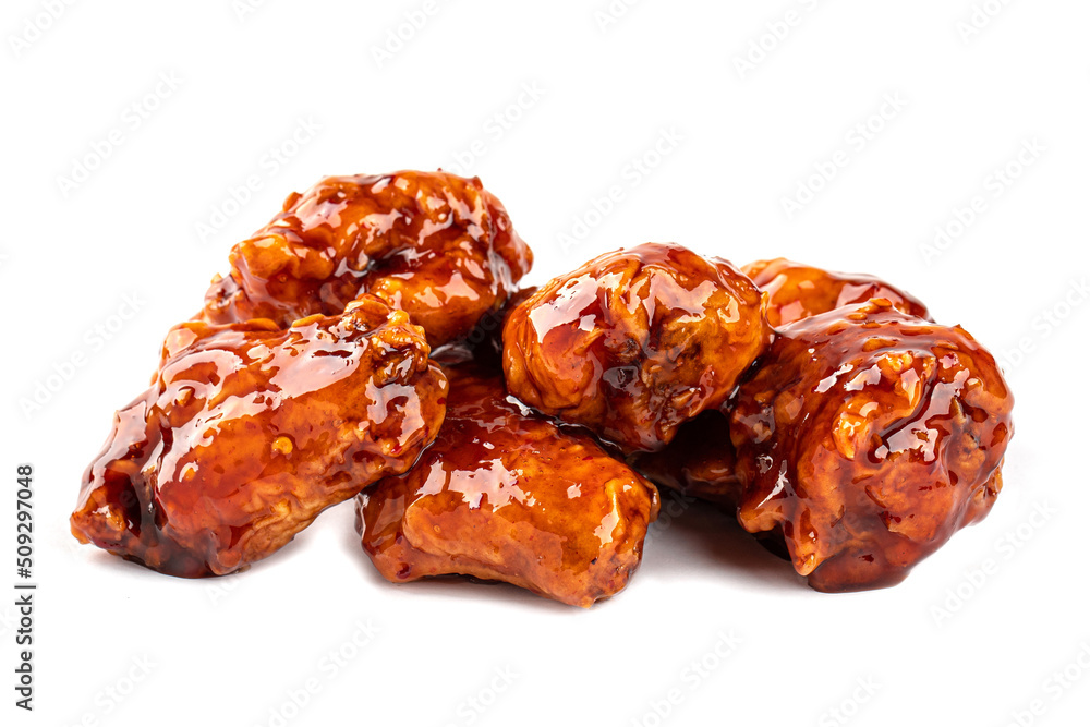 Isolated fried chicken wings with sweet sauce on white background Isolated fried chicken wings with sweet sauce on white background