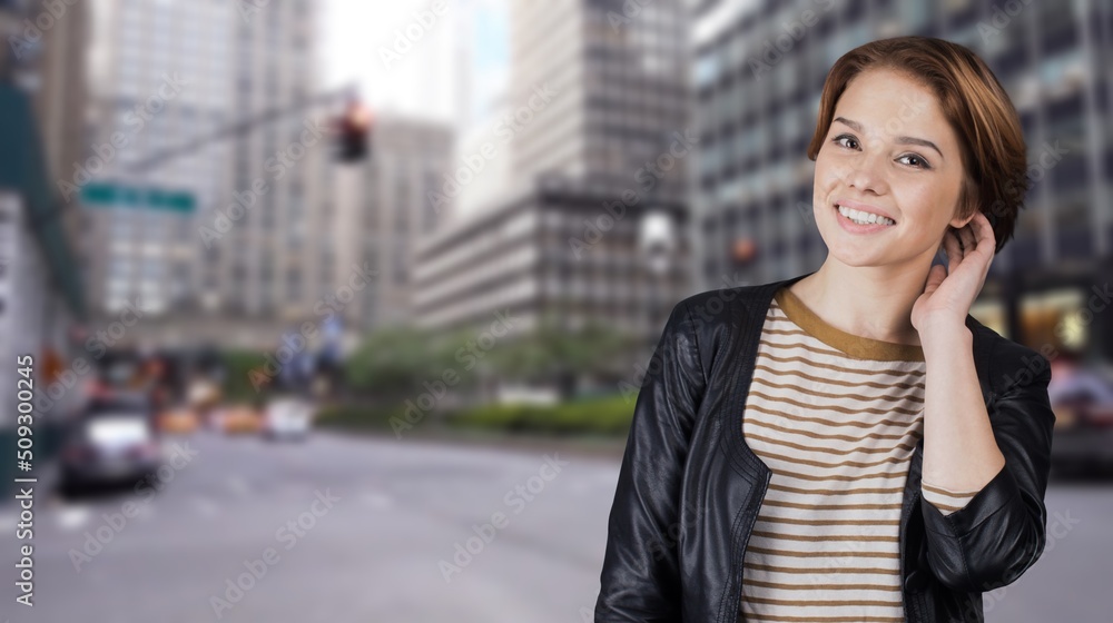Beautiful happy girl laughing and smiling posing against background, looking happy, wearing clothes Beautiful happy girl laughing and smiling posing against background, looking happy, wearing clothes