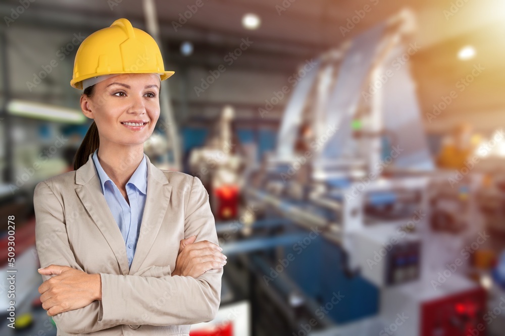 Portrait smart women worker standing happy smiling in factory industry workplace Portrait smart women worker standing happy smiling in factory industry workplace