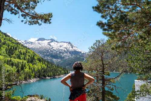 woman looking lake of Oredon in the french Pyrenees mountains