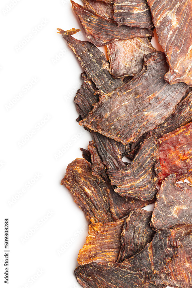 Beef jerky meat. Dried sliced meat isolated on white background.