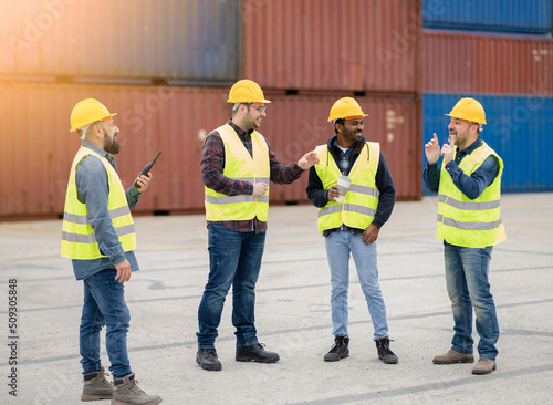 group of workers who are talking in the break logistics shipping goods
