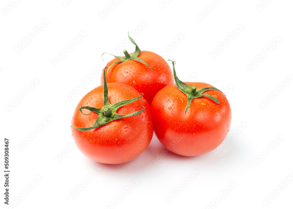 Three red tomatoes with water drops isolated on a white background. Three red tomatoes with water drops isolated on a white background.