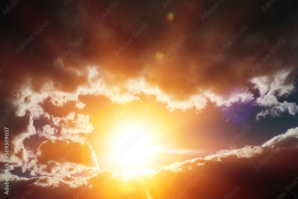 Fototapeta premium Sunlight sun rays shining through clouds in dark.