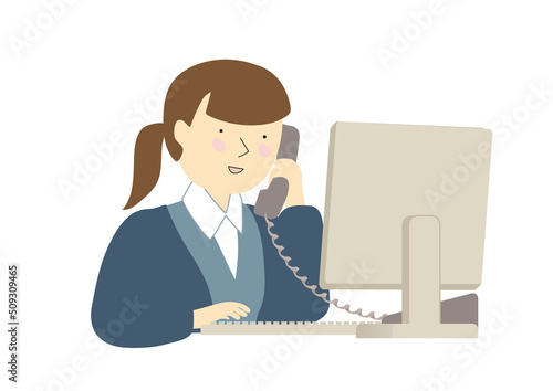 キーボードを打ちながら電話で話す制服を着た事務の若い女性　秋冬