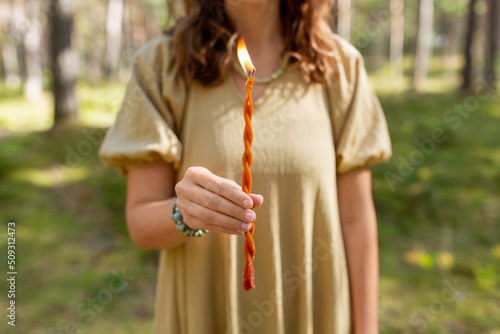 Stampa su tela occult science and supernatural concept - woman or witch with candle performing