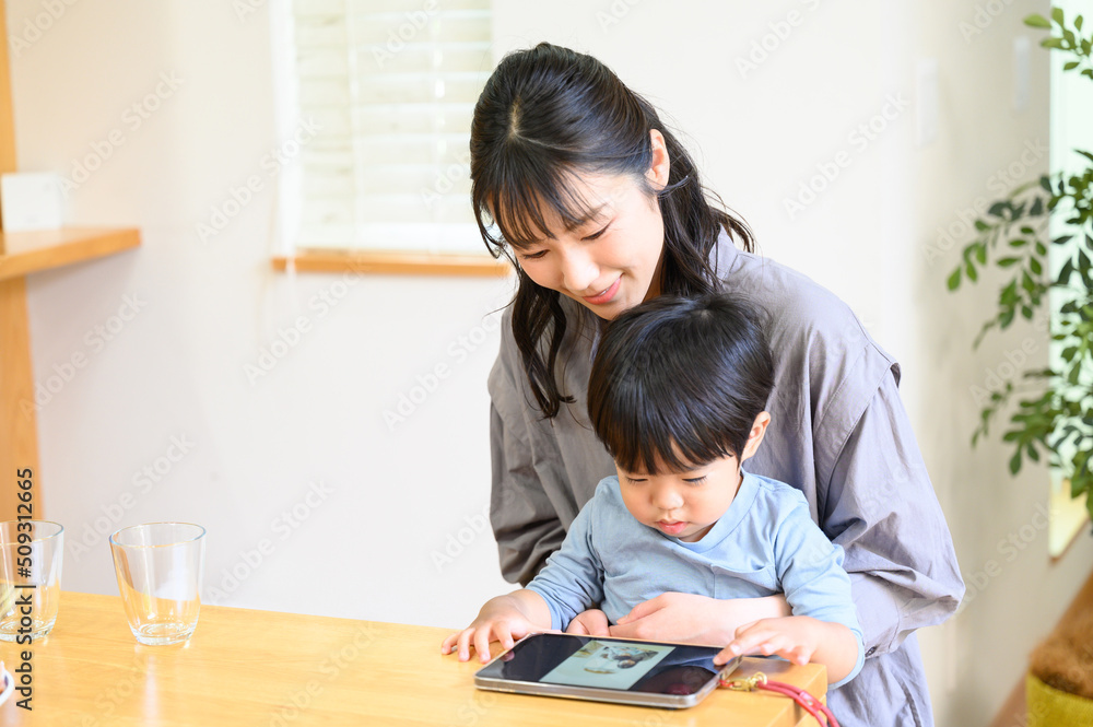 Parents and children playing together on tablets Parents and children playing together on tablets