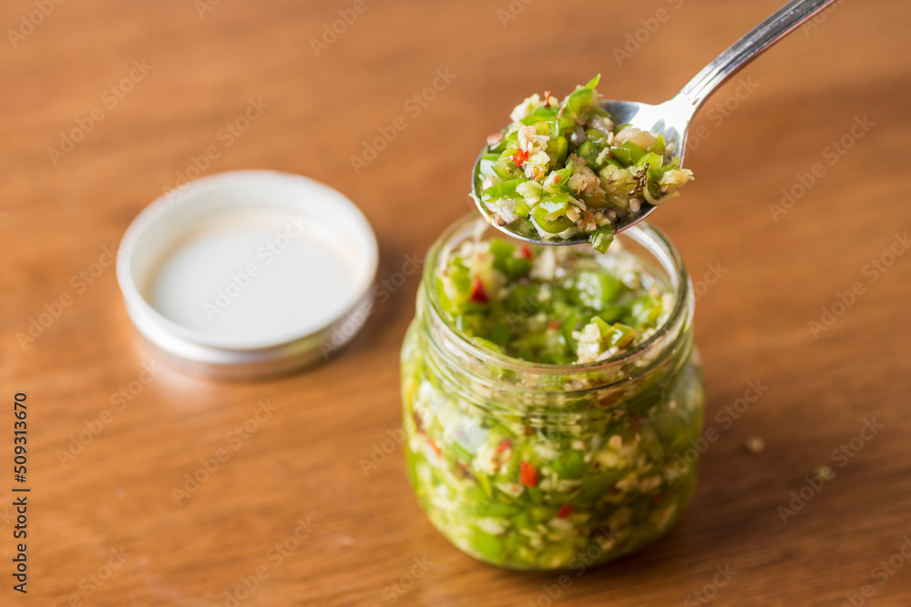 one Glass bottles of manual magnificent green chilli sauce with spoon one Glass bottles of manual magnificent green chilli sauce with spoon