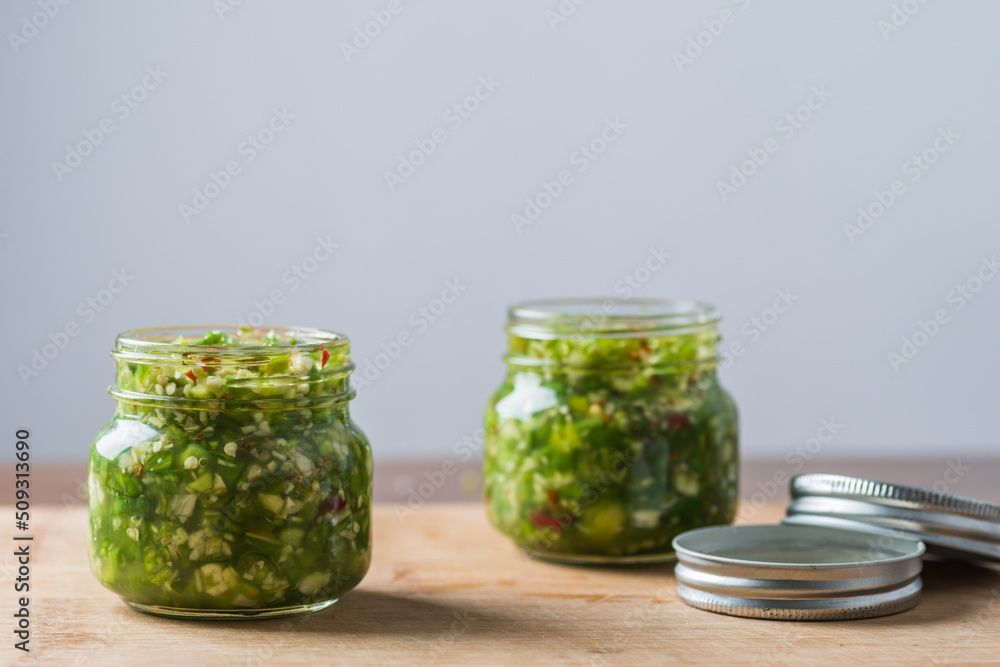 two Glass bottles of manual magnificent green chilli sauce two Glass bottles of manual magnificent green chilli sauce