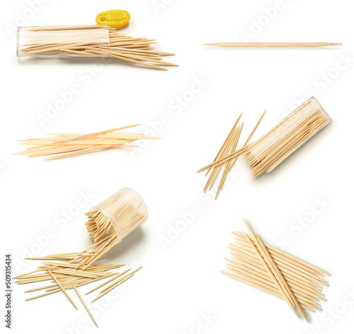 Set of wooden toothpicks on white background photo