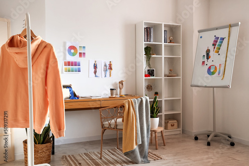Interior of modern studio with workplace of clothes stylist © Pixel-Shot