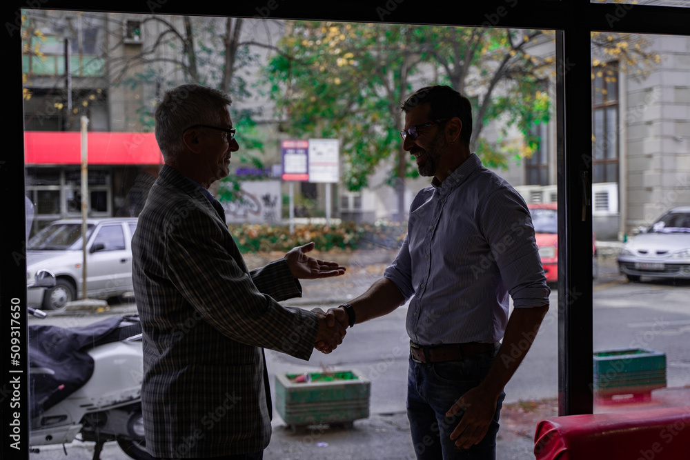 Greeting his boss, silhouette Greeting his boss, silhouette