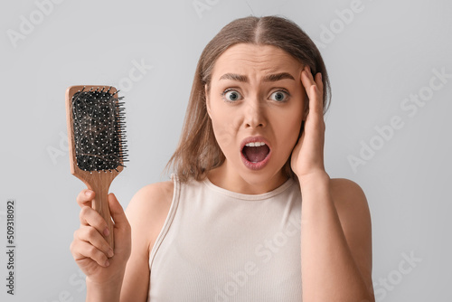 Stressed young woman with h...