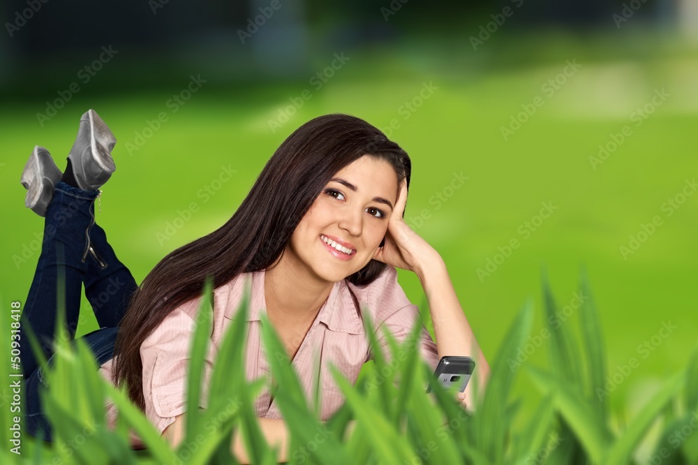 Beautiful Healthy Smiling Young Woman in park or garden. Beautiful Healthy Smiling Young Woman in park or garden.