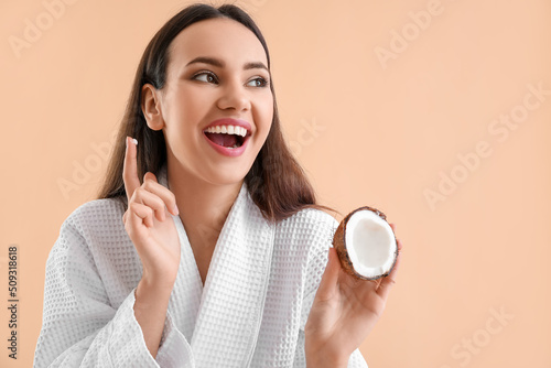 Young woman with coconut an...