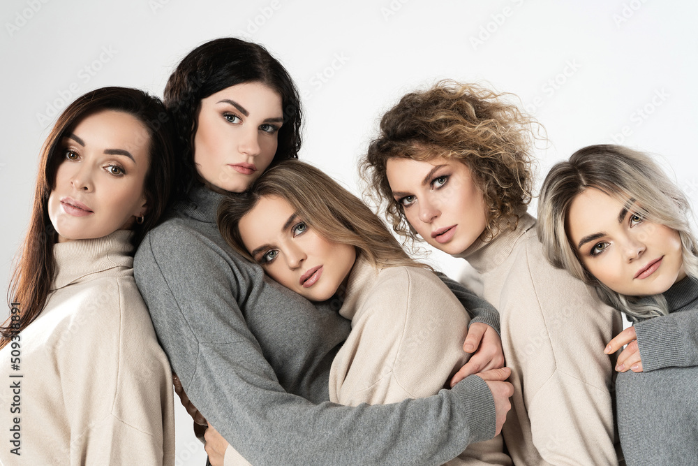 Group of different women wearing turtleneck jumpers on gray background Group of different women wearing turtleneck jumpers on gray background