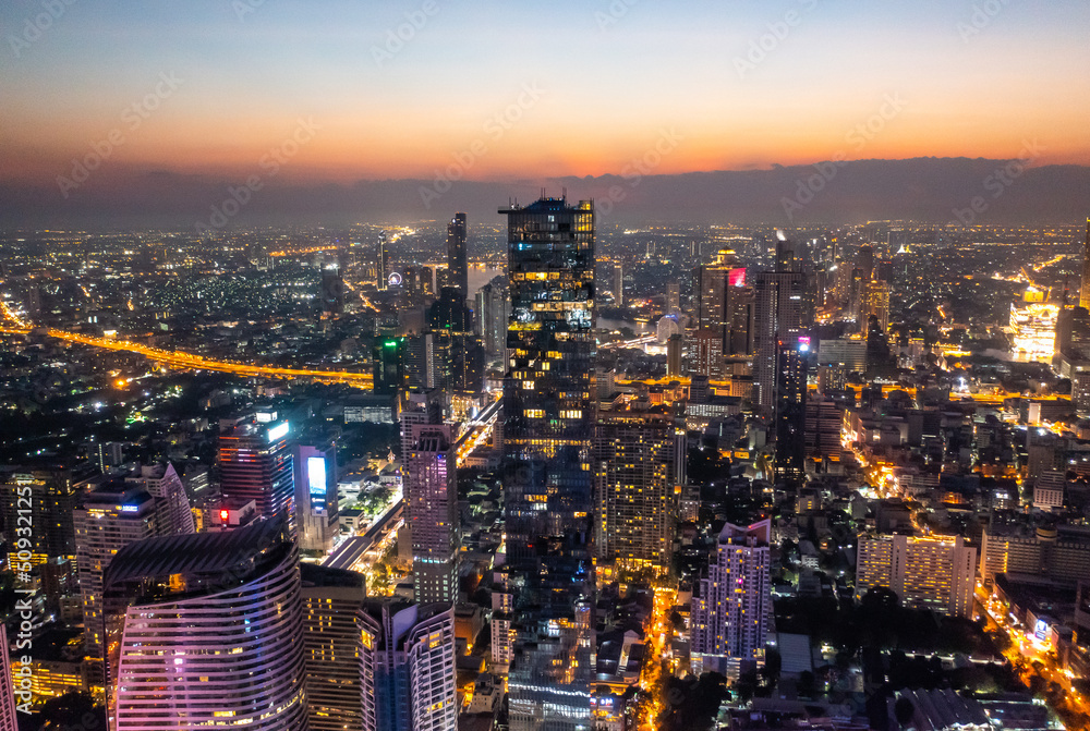 Obraz premium Aerial view of King Power Mahanakhon tower in Sathorn Silom central business district of Bangkok, Thailand