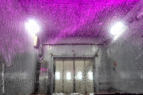 Automatic conveyorized tunnel car wash. A view from inside.
 photo