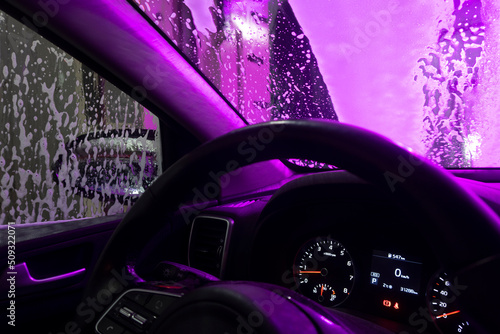 Automatic conveyorized tunnel car wash. A view from inside. 