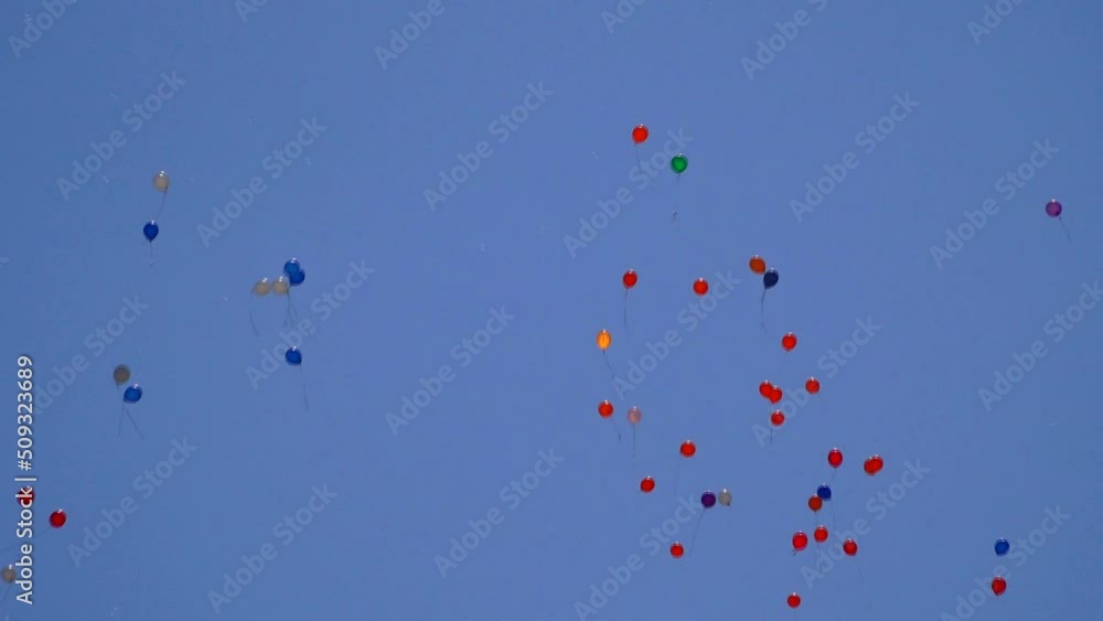 Many balloons are flying in the blue sky Many balloons are flying in the blue sky