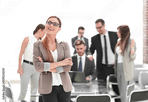 portrait of modern business woman on office background