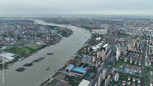 Drone aerial view of Industrial area with oil tank and factories. Industry district in sunny weather in Shanghai China .  Industry, business and economy concept b-roll footage.