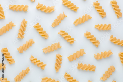 Pattern made of pasta on pastel background. Flat lay.