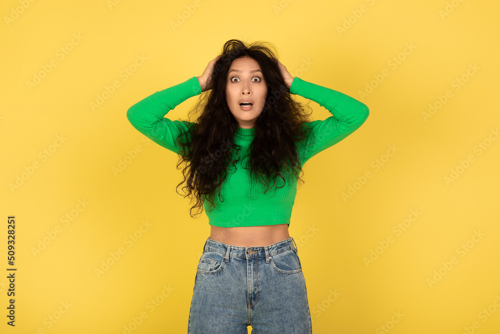 Shocked Arabic Lady Pulling Hair On Head Over Yellow Background Shocked Arabic Lady Pulling Hair On Head Over Yellow Background