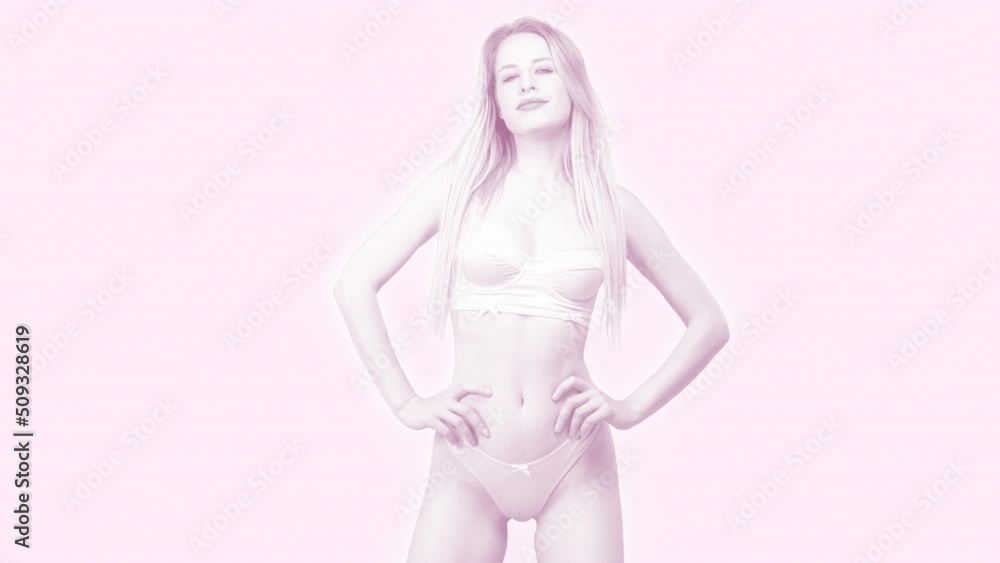 Female dancer posing against pink background Female dancer posing against pink background