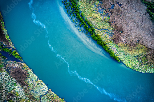 Drone view of different vegetation types and water along the Barwon River and Lake Connewarre near Barwon Heads, Victoria, Australia.