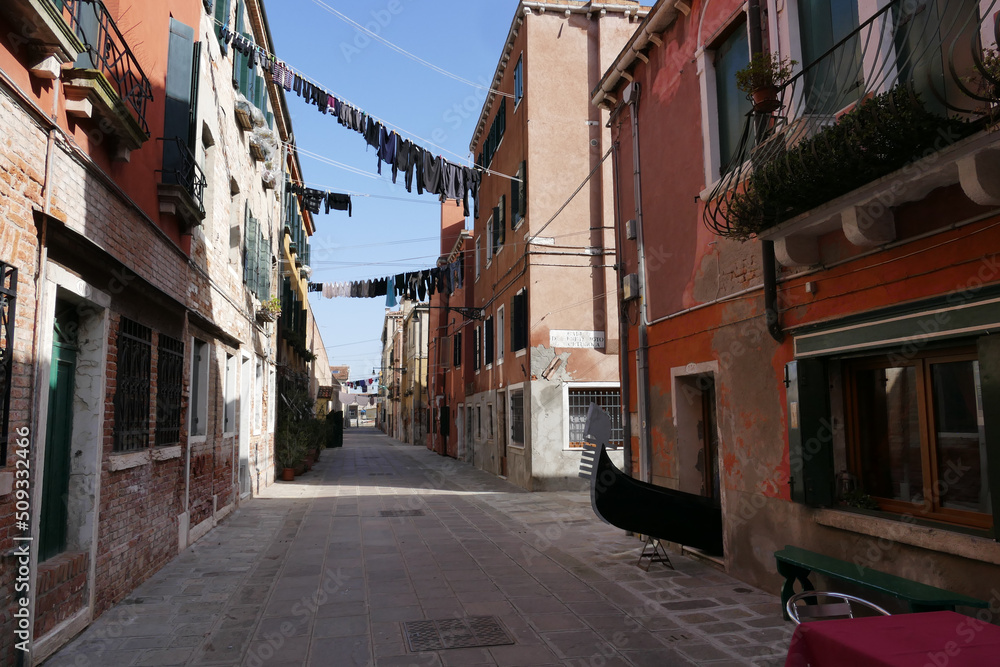 Strange street of Venice with a Gondola