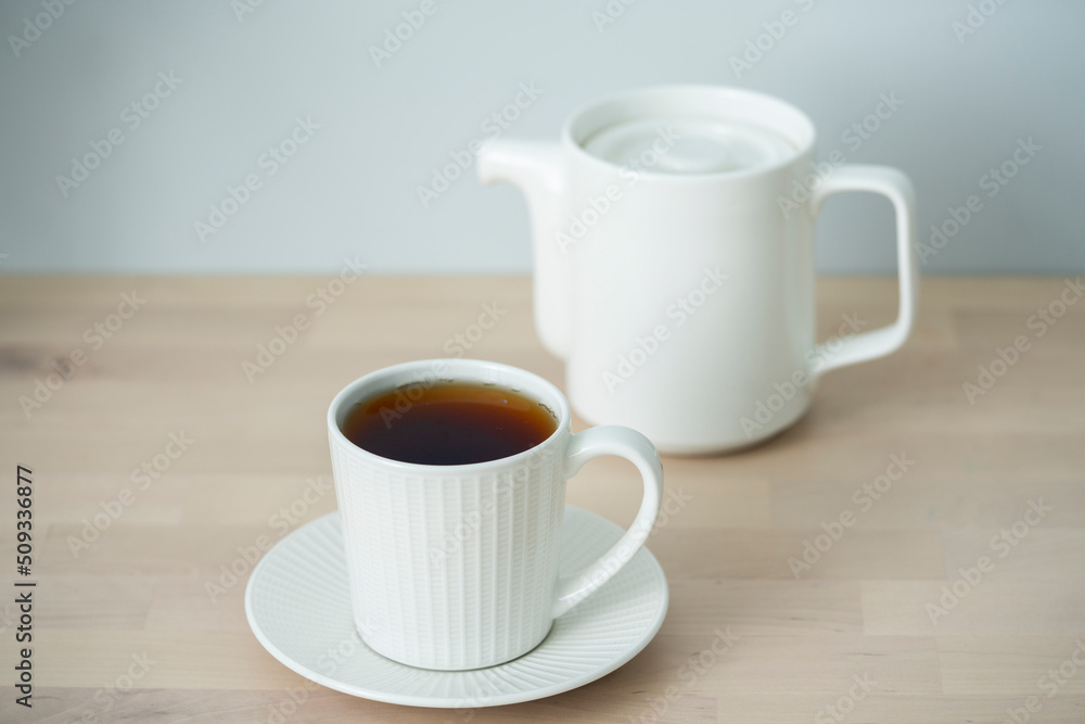 Obraz premium Tea time. Cup of tea with a teapot.