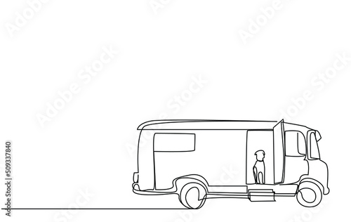 a big classic caravan and a dog inside looking out vacation concept