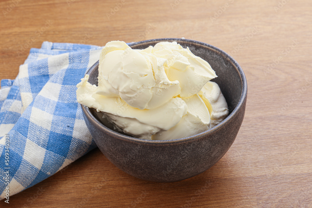 Italian soft mascarpone cheese in the bowl Italian soft mascarpone cheese in the bowl