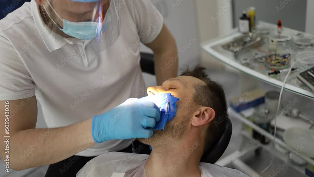 real treatment. reportage. the dentist injects an anesthetic into the